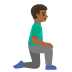 man kneeling facing right, medium-dark skin tone